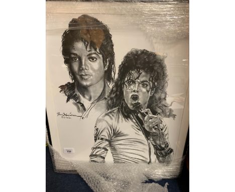 A FRAMED PRINT OF A PORTRAIT OF MICHAEL JACKSON 