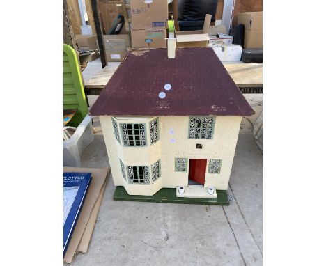 A VINTAGE WOODEN DOLLS HOUSE 