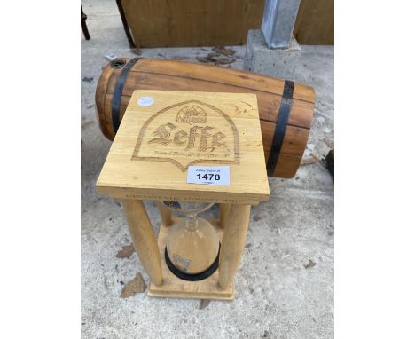 A MINIATURE GRANTS WHISKEY BARREL ON STAND AND A LEFFE SAND TIMER 