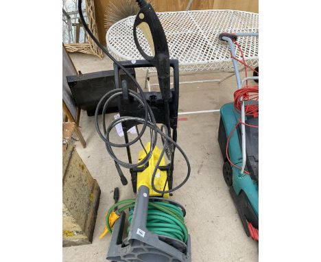 A KARCHER 411A ELECTRIC PRESSURE WASHER AND A REEL OF HOSE PIPE 