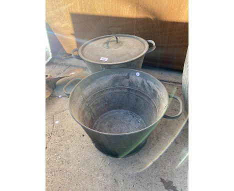TWO LARGE VINTAGE DOUBLE HANDLED PANS ONE WITH A LID 