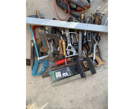 AN ASSORTMENT OF HAND TOOLS TO INCLUDE SAWS, SPANNERS AND HAMMERS ETC 