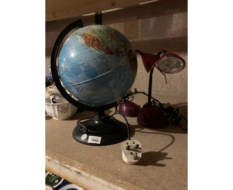 AN ILLUMINATED GLOBE AND TWO PINK READING LAMPS 