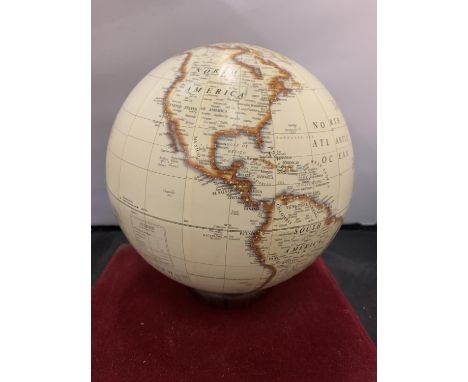 A GLOBE ON WOODEN BASE 