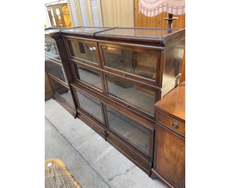 A GLOBE WERNIKE BOOKCASE ENCLOSING FOUR SMALL DOORS, TWO LARGE DOORS AND TWO DRAWERS TO THE BASE, 51.5" WIDE 