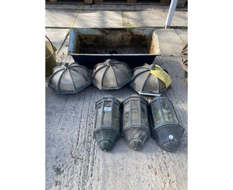 A CAST IRON DOWN SPOUT HOPPER AND A COLLECTION OF DECORATIVE OUTSIDE LIGHTS 