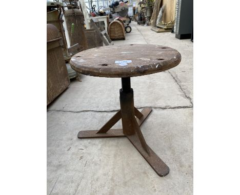 A VINTAGE INDUSTRIAL STYLE WOODEN STOOL WITH CAST BASE 