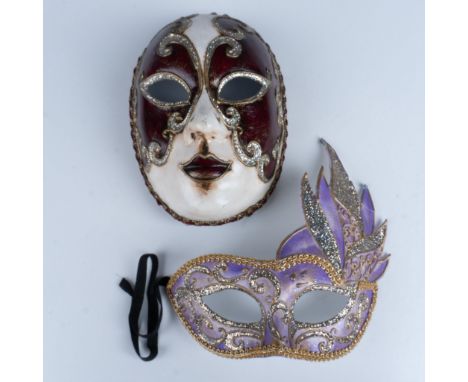 Lovely duo of papier mache masks that consists of a purple glittery eye mask with rope gilt borders, and a two tone costume m