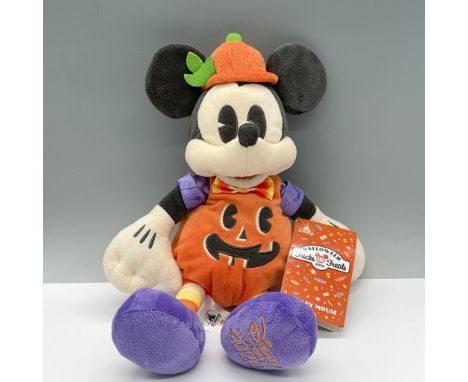 This cute stuffed Mickey is dressed as a Jack-o-lantern. Has original Tag. Issued: 2002Dimensions: 10"L x 5.25"W x 14.5"HManu