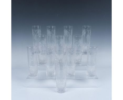 This elegant set of clear crystal features an intricate design with clusters of grapes and flowers etching. The lower proport