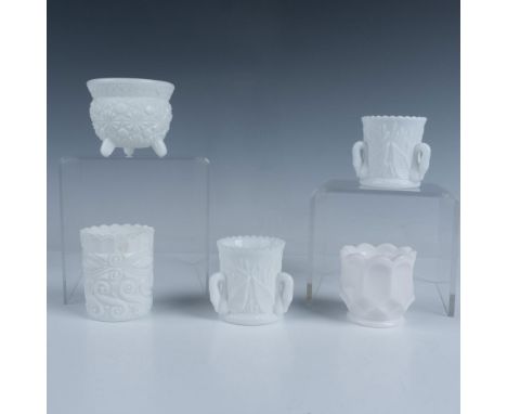 Fun collection of five milk glass toothpick holders with various designs and sizes. The largest is shaped like a footed cauld