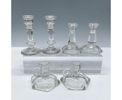 Includes six pieces of clear crystal candle holders. Includes: 1 pair of Heisey Mini Tom Thumb candlesticks, marked with H lo