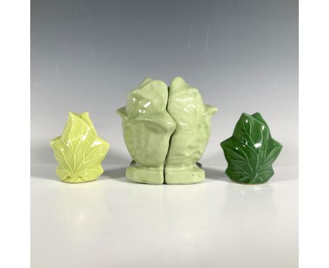 Four salt and pepper shakers including two that form a head of lettuce with the seasoning written on their base along with tw