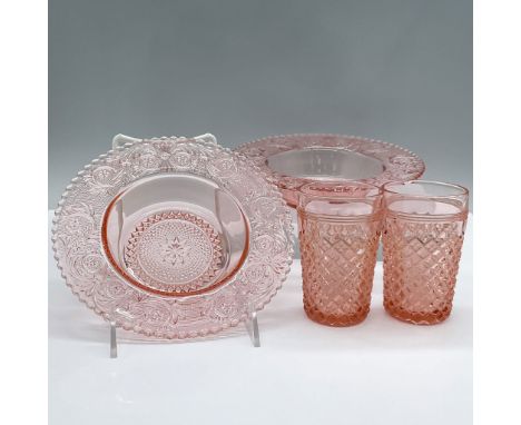 Features 2 plates with a decorative Chantilly pattern and 2 glasses with a cubed pattern. Plates measure 7"L x 7"W x 2"H. Cup