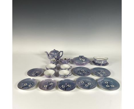 Iridescent metallic glossy set includes a teapot, a creamer, a sugar bowl, four tea cups, four saucers, a pot, a bowl, and fo