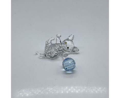 Adorable figural designed in clear crystal faceted body with olivine eyes playing with blue crystal ball. Swarovski backstamp