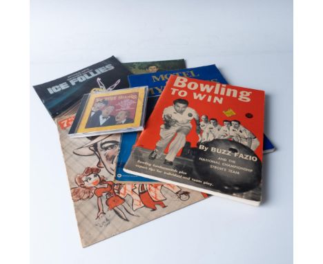 Diverse lot that includes a 23"x23" poster of Yoko Ono (1971), a CD of The Three Stooges, the Official Souvenir Book from The