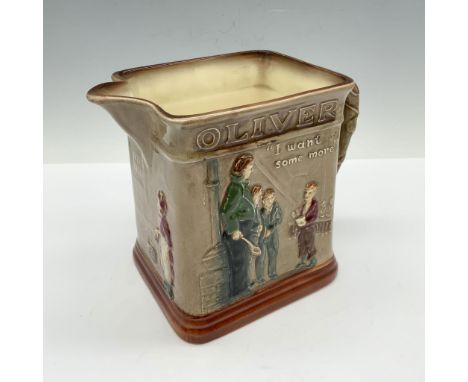 Glossy porcelain pitcher with high relief images of characters and settings from the Oliver Twist novel by Charles Dickens. A