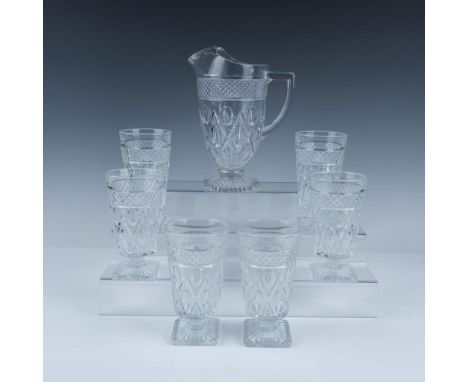 Vintage pressed glass beverage set featuring an elegant pitcher and four matching tumblers. Each showcases a popular pattern 