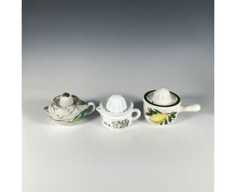 An adorable collection of small juice cups with matching reamers, decorated with floral and fruit designs. Tallest item: 6"L 
