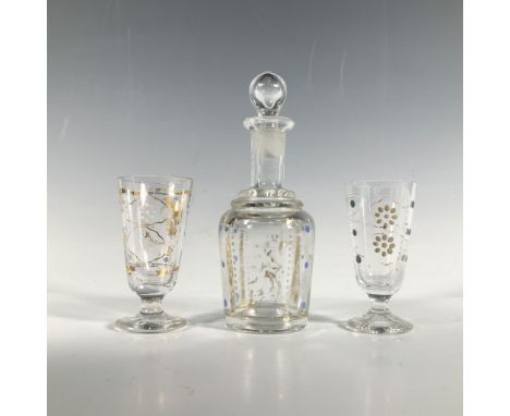 A miniature decanter and two cordial glasses, clear with gilded accents and delicate blue and white dot art. Dimensions of th