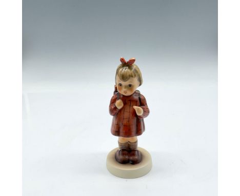 M.I. Hummel Club figure of little girl, colored in brown, red and green. Goebel Hummel backstamps. This item has its original