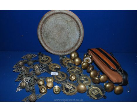 A quantity of brass to include Horse Brasses, Door Furniture, A small German alarm clock, Plate etc.