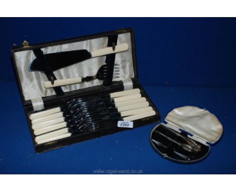 A cased set of Sheffield stainless steel fish Knives and forks and a fish serving Fork and knife together with a cased pair o