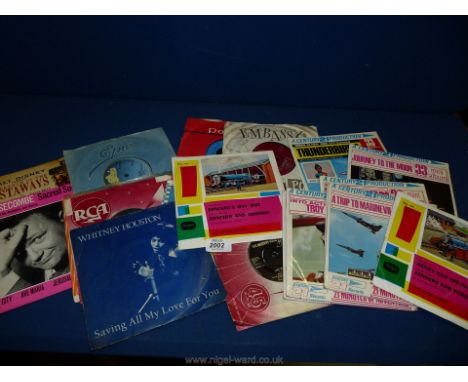 A quantity of 45's to include Whitney Houston, Dorothy Squires, Thomas the Tank engine stories.