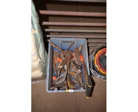 A plastic crate containing various hand tools to include hand saws; clamps; smoothing plane; hammer etc