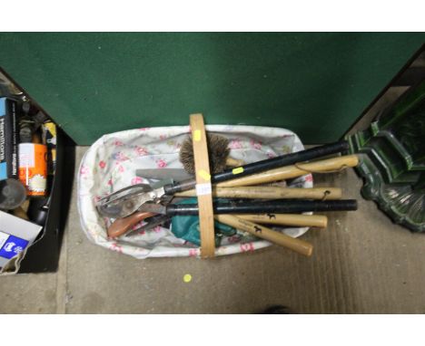 A garden trug basket and various gardening tools