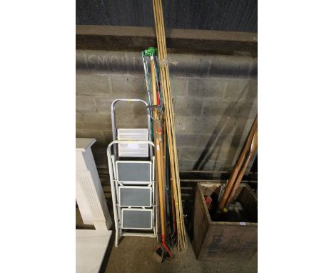 A rotary clothes airer; a quantity of bamboo cane; long handled garden tools to include Wolf Tool hoes, rakes etc.