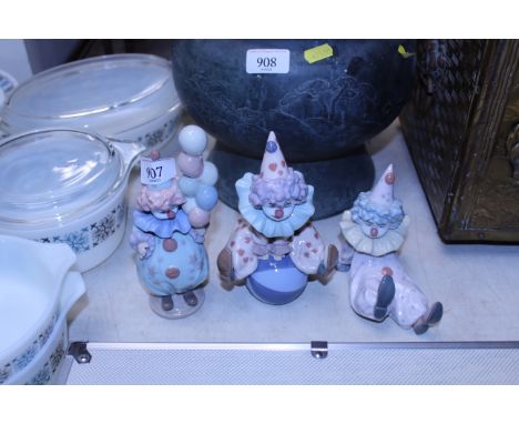 Three Lladro figurines in the form of clowns