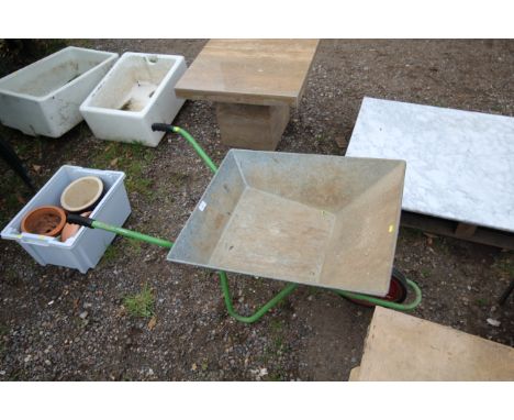 A light weight metal wheel barrow