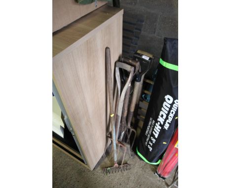 A quantity of gardening tools to include digging fork, spades, rake etc.