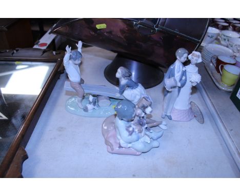 A Lladro figurine of a boy and girl on a seahorse N-14K together with a Lladro figurine of a couple C-18J and another Lladro 