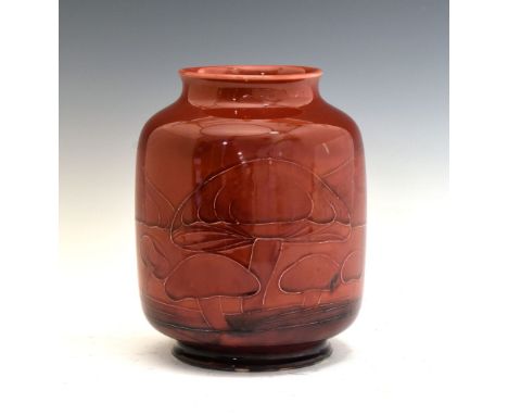 William Moorcroft flambe 'Claremont' pattern pottery vase, of barrel form with tube-lined toadstool decoration on a shaped ru