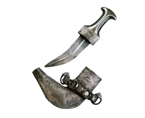 Omani Jambiya, 20th Century, the curved double edged blade with medial ridge and waisted dark horn hilt with white metal moun