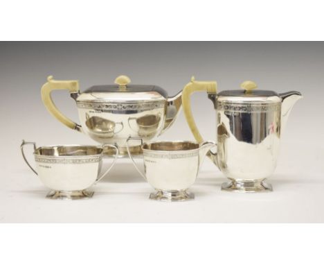 George VI silver four piece tea set of tapering rectangular form comprising: hot water jug, teapot, sugar basin and cream jug