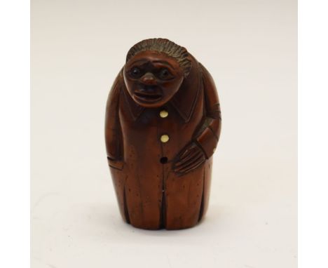 Late 18th/early 19th Century carved coquilla nut novelty snuff box in the form of a gentleman with buttoned long coat, 6cm hi