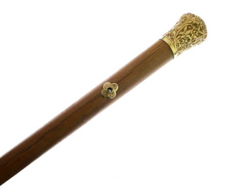 Victorian 18ct gold-mounted Malacca walking stick, the bulbous terminal with repousse scroll decoration, centrally engraved w