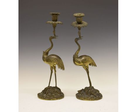 Pair of 19th Century bronze candlesticks, after a design by Thomas Abbott (d.1849), modelled in the Oriental style as storks 