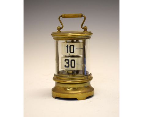 Early to mid 20th Century brass-cased Plato or ticket clock, having two registers of tickets displaying the time within cylin