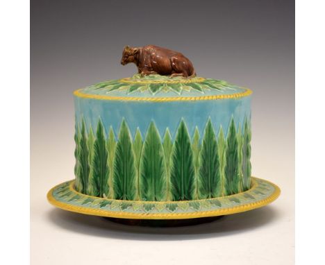 Victorian George Jones majolica cheese dome and stand, modelled as a recumbent cow within rope twist borders and stiff leaf d