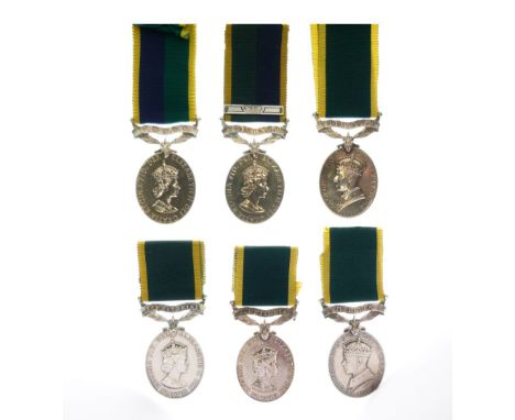 Four Elizabeth II Territorial Efficiency Medals awarded to 5619072 TPR C Granger of the Royal Auxiliary Corps, 23850039 Lance