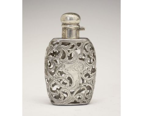 Continental white metal scent bottle, the flask-form body with foliate scroll cage-work overlay, stamped 999/1000 Fine, 10.5c