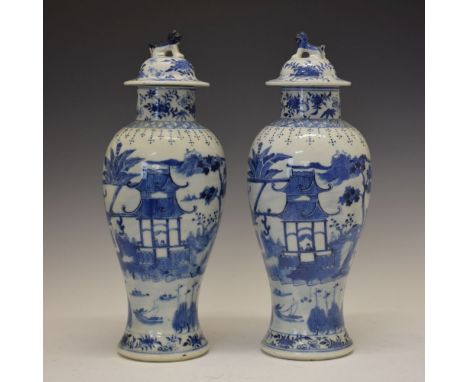 Pair of 19th Century Chinese porcelain vases and covers, each of Meiping form, the domed cover surmounted by a Dog of Fo fini