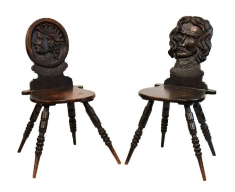 Two unusual 19th Century oak hall chairs, in the 'Romayne' tradition, one with oval back and relief-carved profile portrait, 