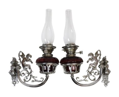 Pair of early 20th Century chrome-plated wall lights, probably from a Romany 'Vardo' caravan, each having swivel scroll arms 
