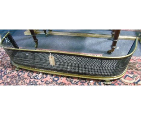 A 19th Century Brass and Steel Fire Kerb, having fretwork panel, raised on claw supports